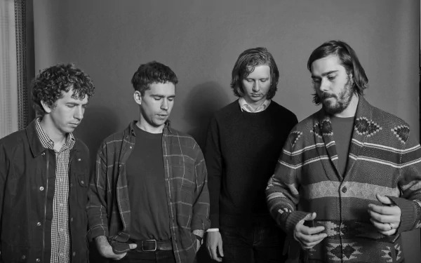 HD desktop wallpaper featuring a black and white photo of the band members of Parquet Courts standing together.