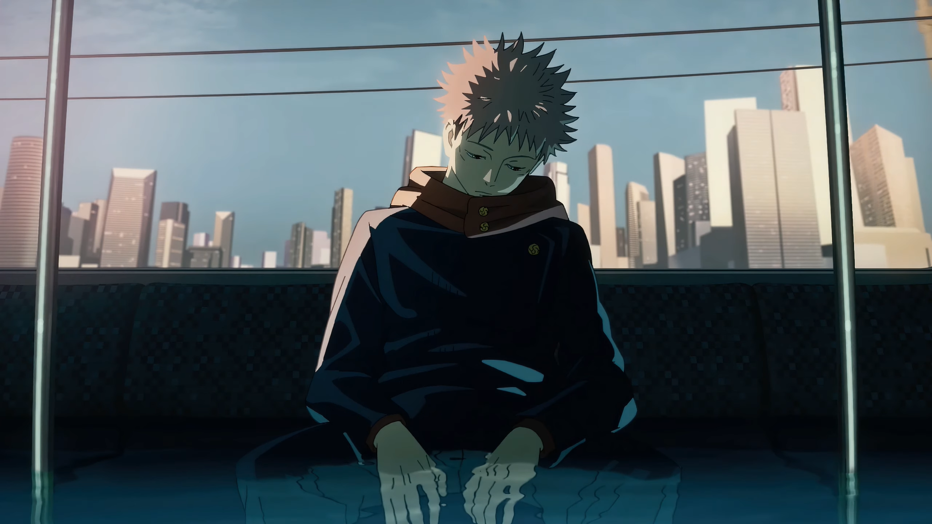 HD desktop wallpaper featuring Yuji Itadori from the anime Jujutsu Kaisen, sitting pensively on a bus with a cityscape in the background.