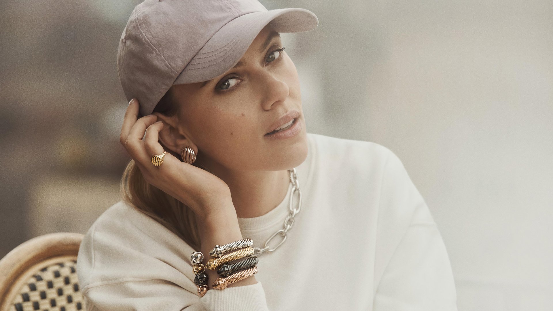 Actress Scarlett Johansson in a high-resolution 4K Ultra HD image, captured in a casual pose with a neutral background, designed as a PC desktop wallpaper.