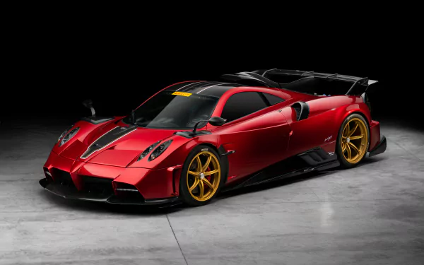 Red Pagani Imola supercar with gold wheels showcased in high detail on an 8K Ultra HD PC desktop wallpaper and background.