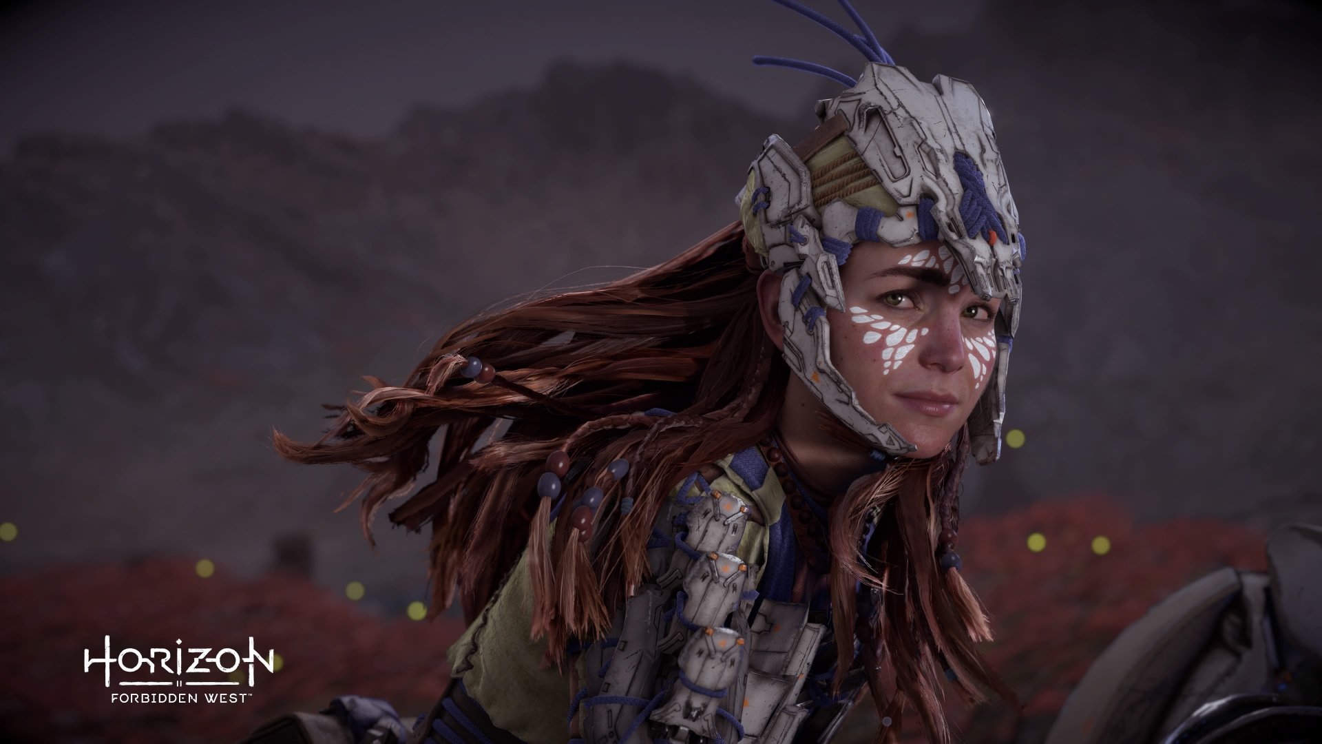 Aloy (Horizon Series) in tribal armor and face paint, wind-swept hair against a dusky landscape — 4K Ultra HD PC desktop wallpaper from the video game Horizon Forbidden West.
