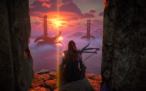 Aloy (Horizon Forbidden West) stands on a cliff above the ocean, gazing at a fiery sunset beyond the Golden Gate Bridge — 4K Ultra HD PC wallpaper.