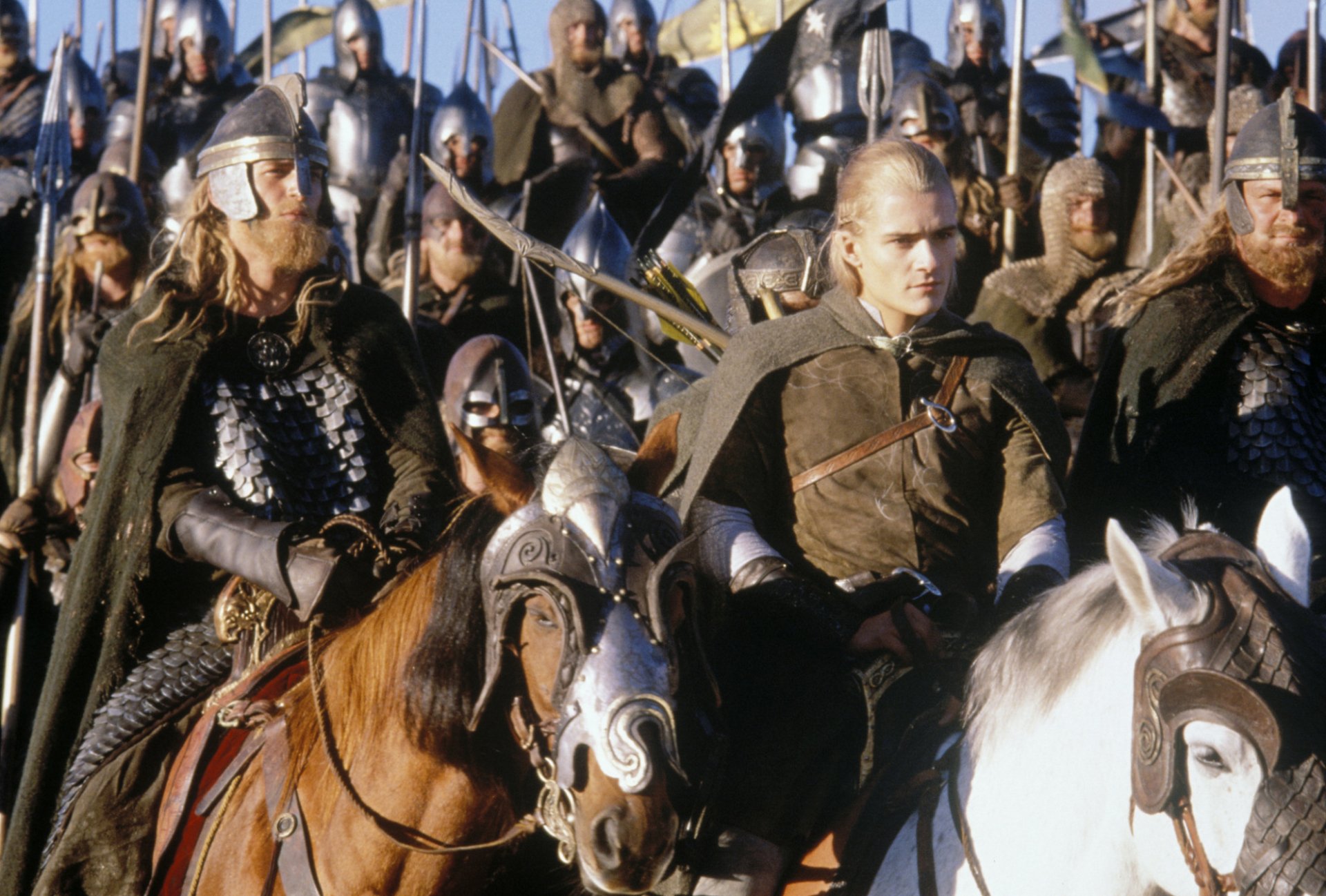 HD PC wallpaper of a blond elven warrior in armor on horseback among soldiers, from the movie The Lord of the Rings: The Return of the King.