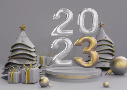 Holiday New Year 2023 2K Quad HD PC desktop wallpaper: silver 2023 balloons with a gold 3, white-and-gold stylized trees, wrapped gifts and ornaments on a gray pedestal backdrop.