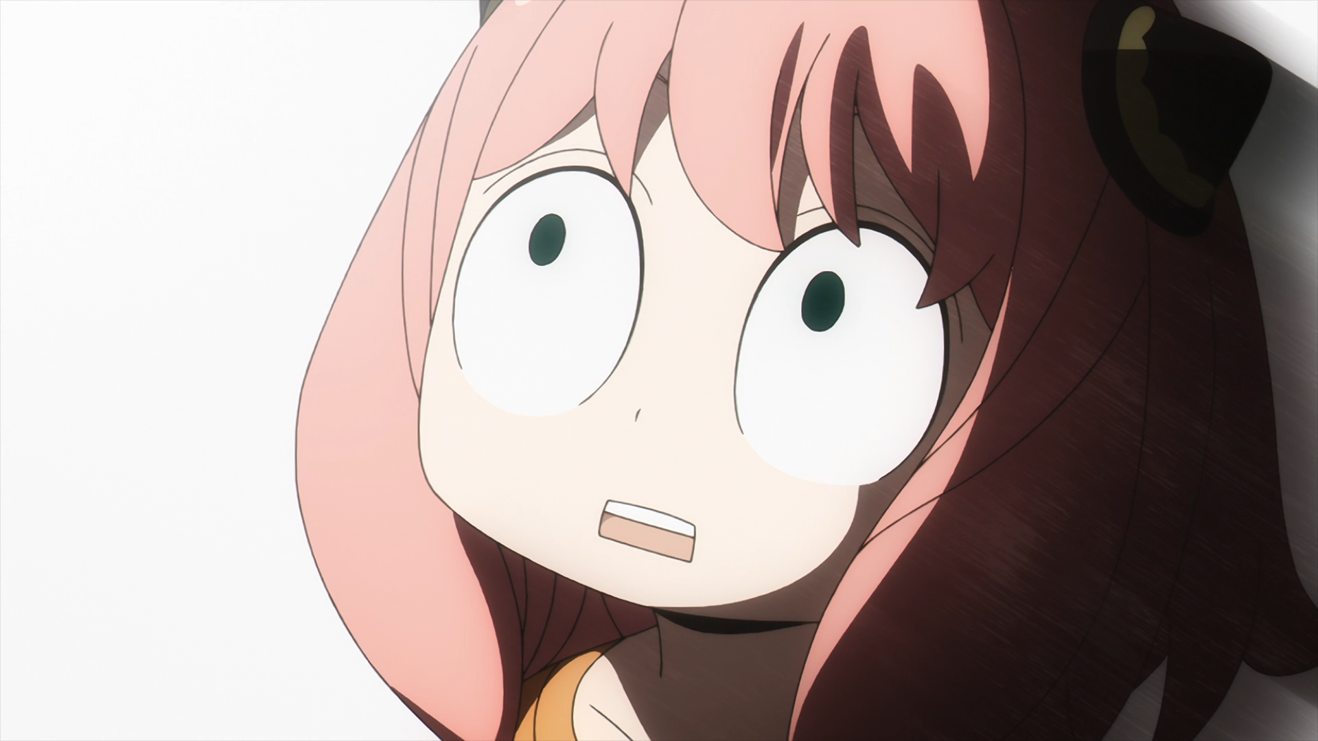 HD anime desktop wallpaper featuring Anya Forger from Spy x Family with her signature wide-eyed, surprised expression.