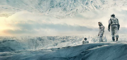 Interstellar movie 5K Ultra HD PC desktop wallpaper: astronauts in suits on a jagged icy plain beneath a looming, inverted glacier sky.