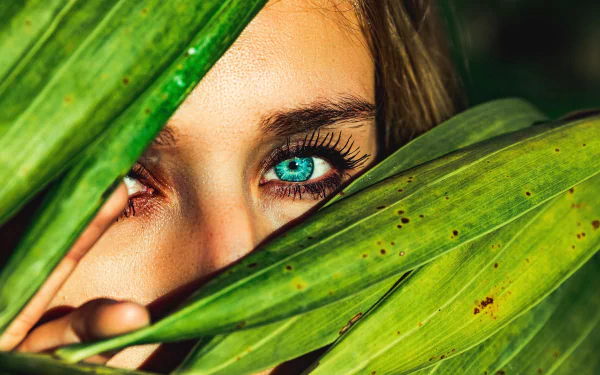 Captivating close-up of a woman's eye in high definition, perfect as a desktop wallpaper and background.