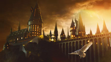 A stunning 4K Ultra HD wallpaper depicting the iconic Hogwarts Castle from the Harry Potter movie series, set against a dramatic sunset and featuring a soaring owl.