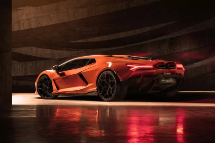 Orange Lamborghini Revuelto in a dim concrete garage with glossy reflections on the wet floor — 8K Ultra HD PC desktop wallpaper/background.