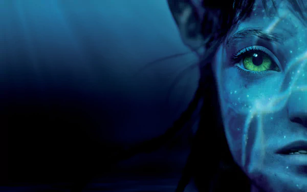 Close-up of a Na'vi character from the movie Avatar: The Way of Water in 8K Ultra HD, showcasing detailed blue skin and a glowing green eye.