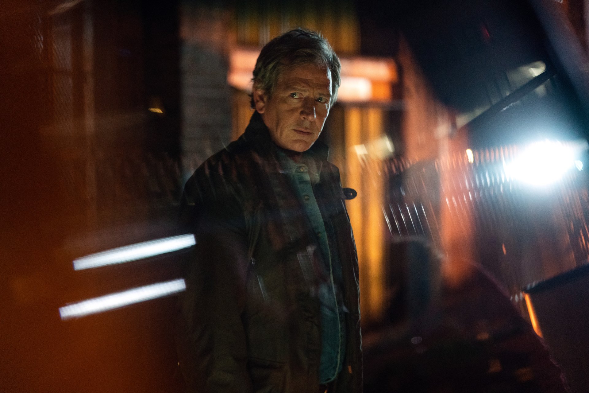 HD desktop wallpaper featuring a mysterious figure from Secret Invasion with dramatic lighting in the backdrop.