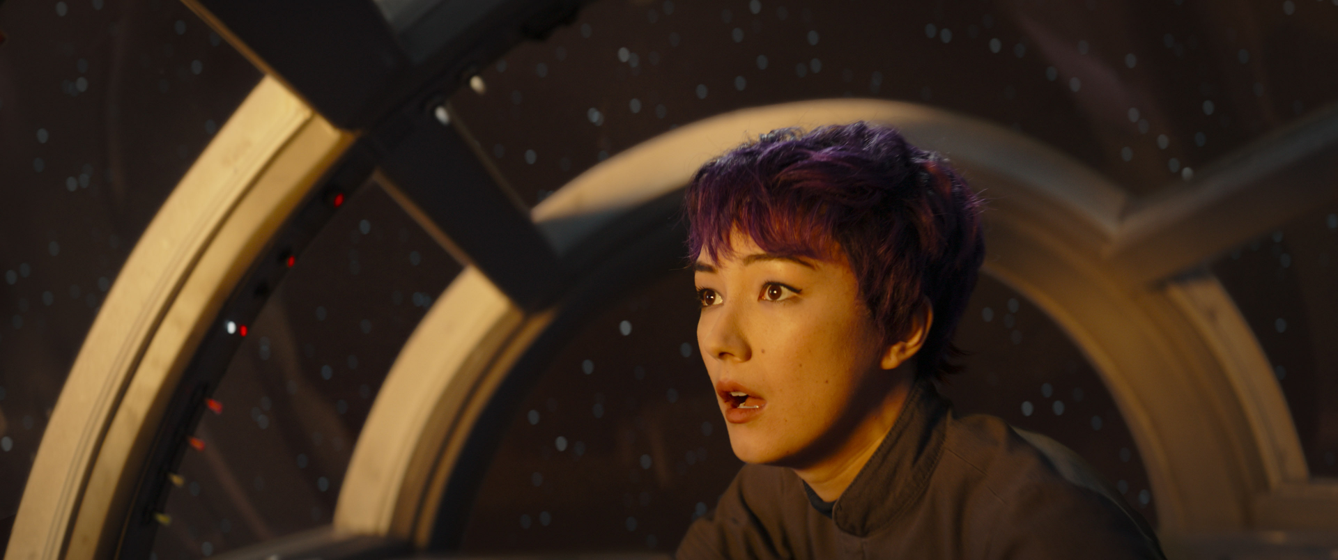 HD wallpaper of a woman with purple hair looking out of a spaceship window, reflecting themes from Ahsoka and Sabine Wren.