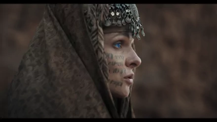 HD wallpaper featuring a profile view of Lady Jessica from Dune: Part Two, adorned with a patterned headscarf and facial markings.