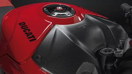 HD desktop wallpaper featuring a close-up of a red Ducati Streetfighter V4's tank and details.