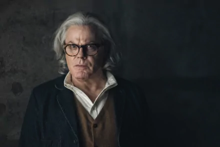 Elderly individual in a contemplative pose against a textured background, HD wallpaper with a culprits theme.