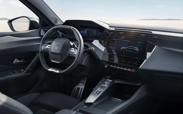 A sleek interior of a Peugeot e-308, showcasing modern design elements, advanced technology, and a spacious dashboard. This HD image serves as a stylish desktop wallpaper.