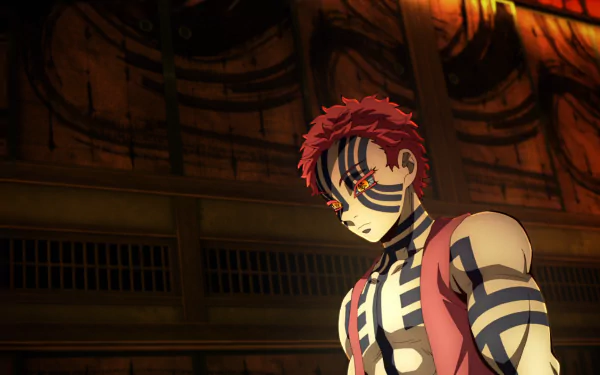 HD PC desktop wallpaper featuring Akaza from the anime Demon Slayer: Kimetsu no Yaiba, showcasing his distinctive red hair and blue-striped demon markings in a dimly lit setting.