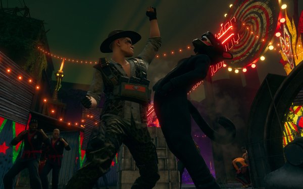HD wallpaper of an action-packed scene from Saints Row (2022) featuring characters in a dynamic fight with festive lights in the background.