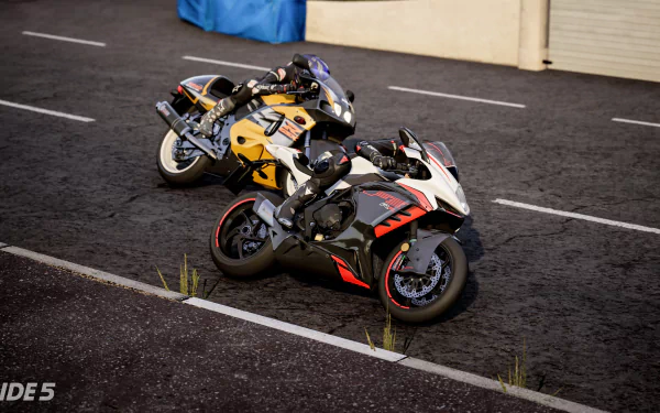 HD desktop wallpaper from the video game Ride 5 featuring two detailed sport motorcycles parked on a tarmac surface.