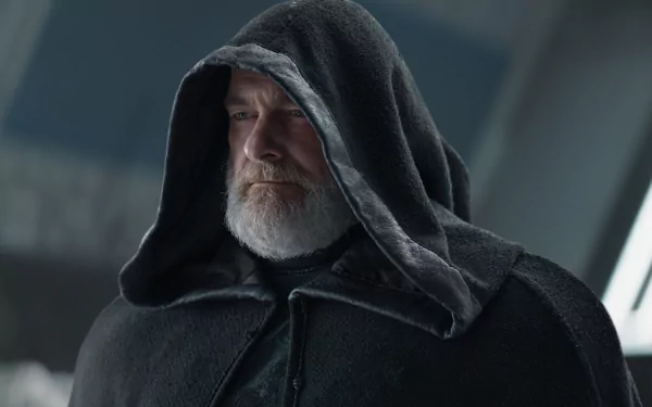 HD desktop wallpaper featuring a mysterious cloaked figure reminiscent of Ahsoka Baylan Skoll theme.