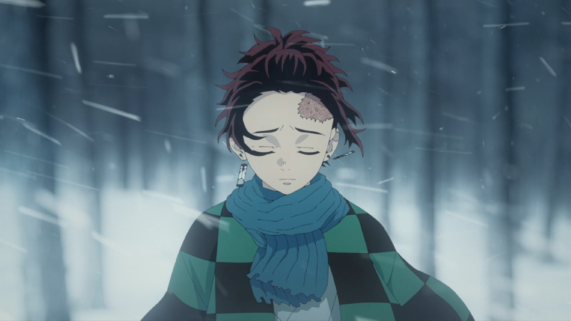 HD PC desktop wallpaper featuring Tanjiro Kamado from the anime Demon Slayer: Kimetsu no Yaiba, with a serene expression amid a snowy, misty forest background.