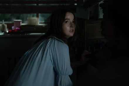 A suspenseful HD desktop wallpaper featuring a woman looking shocked and frightened in a dimly lit room with the ominous caption 'No One Will Save You'.