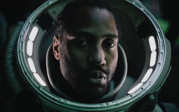 Astronaut in a spacesuit helmet with a reflective visor, featured in The Creator (2023) movie, suitable as an HD desktop wallpaper and background.