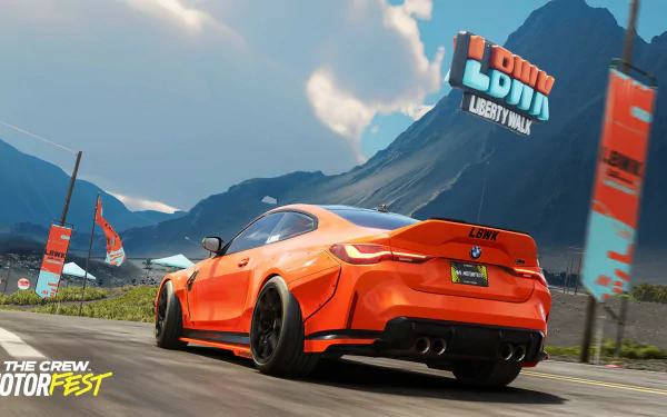 HD desktop wallpaper featuring a dynamic scene from The Crew Motorfest with a sleek orange sports car racing on a scenic mountain road.