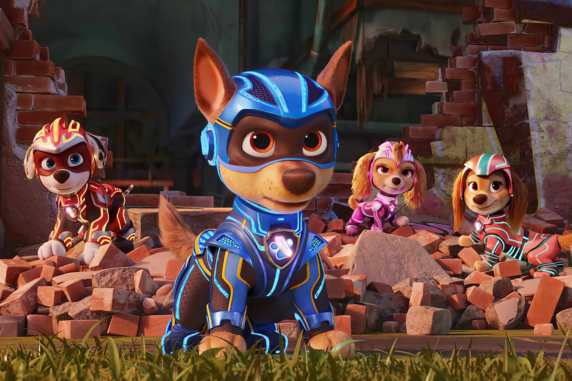 A vibrant HD desktop wallpaper featuring characters from PAW Patrol: The Mighty Movie, showcasing a heroic pup in blue gear and two friends amidst a colorful, whimsical backdrop.
