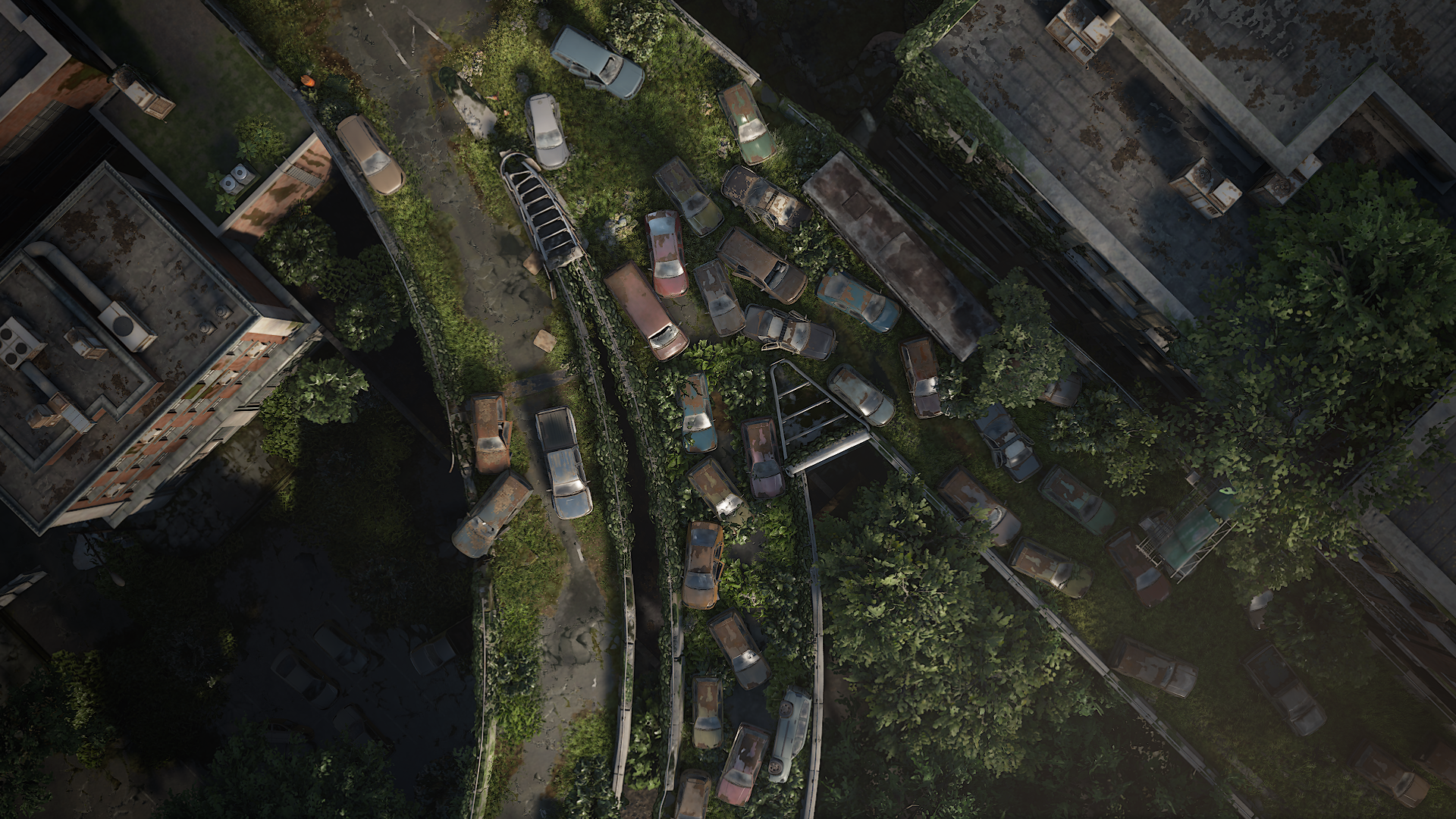 HD PC desktop wallpaper from the video game The Last of Us Part I: aerial view of an overgrown, abandoned highway choked with rusting cars and creeping vines.