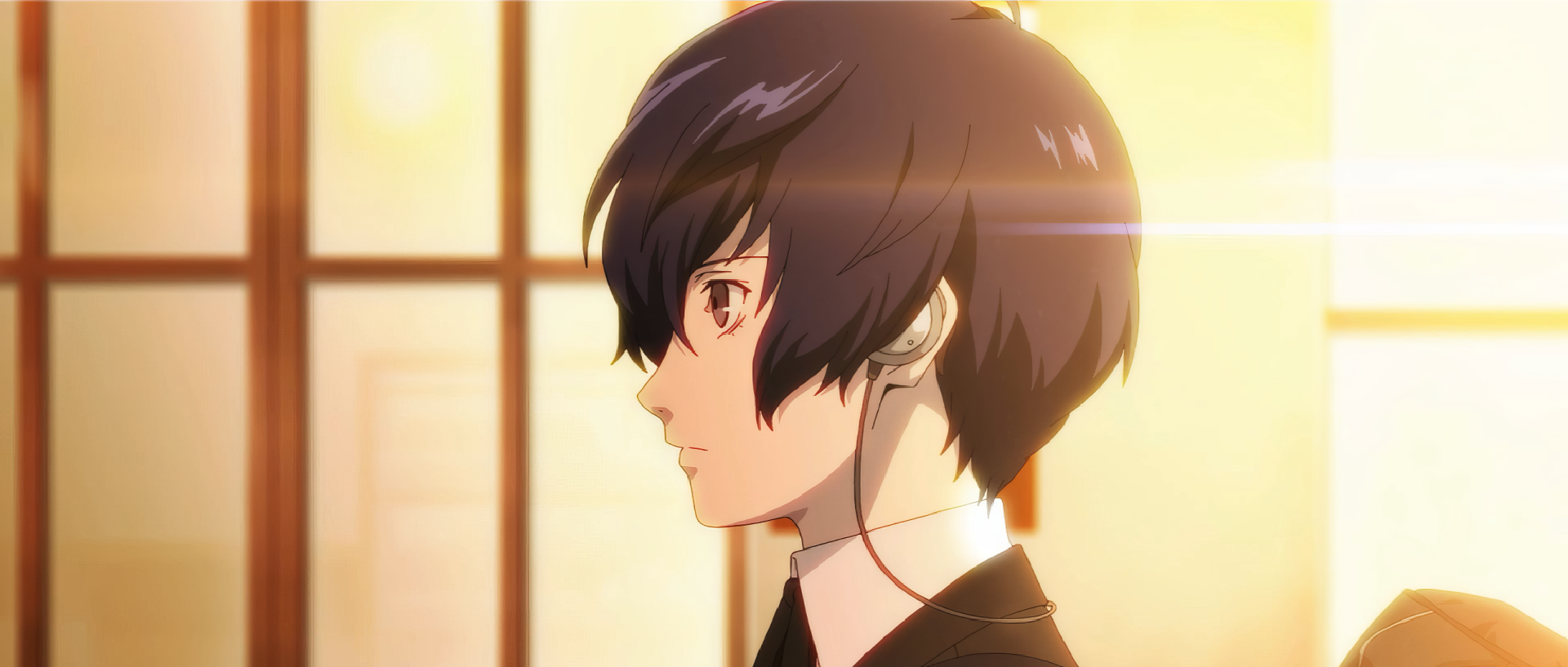 A striking HD wallpaper featuring Makoto Yuki from Persona 3 Reload, showcasing a side profile with a warm, illuminated background that enhances the character's contemplative expression.