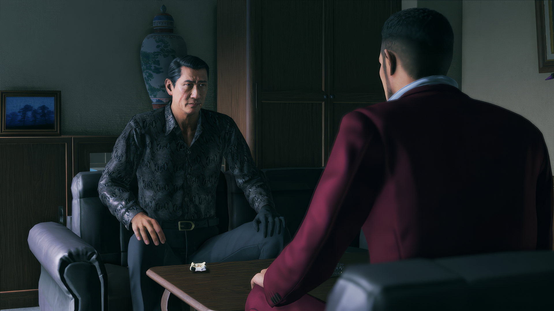 HD Wallpaper of a pivotal scene from Yakuza: Like a Dragon featuring two characters in a tense office conversation for desktop background.