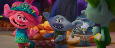 Colorful scene from the movie Trolls Band Together, featuring cheerful trolls in vibrant attire with a backdrop of fun, playful elements and a warm atmosphere.