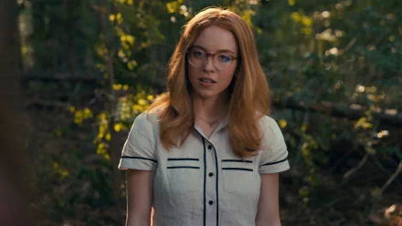 HD desktop wallpaper featuring a character tagged as Madame Web, portrayed by an actress resembling Sydney Sweeney in a forest setting.