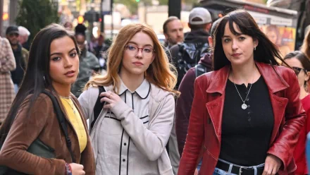 A striking HD wallpaper featuring Sydney Sweeney, Dakota Johnson, and Isabela Merced walking together, showcasing their stylish looks in an urban setting.