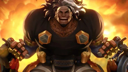 Overwatch 2 character Mauga in an HD desktop wallpaper with a fiery background, showcasing the imposing new hero in dynamic pose.