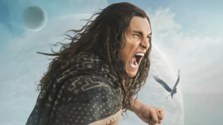 A dramatic HD wallpaper from the movie Rebel Moon, featuring a fierce character with long hair, passionately shouting against a celestial backdrop.