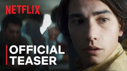 Netflix's 'Society of the Snow' Official Teaser featured as HD wallpaper with a close-up of a concerned young male character.