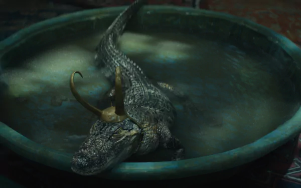 HD desktop wallpaper featuring a depiction of Loki as a reptile submerged in water, serving as a mysterious and thematic background.