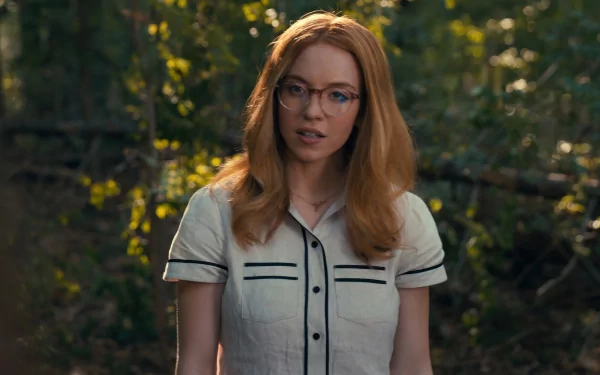 HD desktop wallpaper featuring a character tagged as Madame Web, portrayed by an actress resembling Sydney Sweeney in a forest setting.