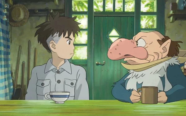 HD desktop wallpaper featuring an animated scene with a young boy and a character with a prominent nose sitting at a table, titled 'The Boy and the Heron'.