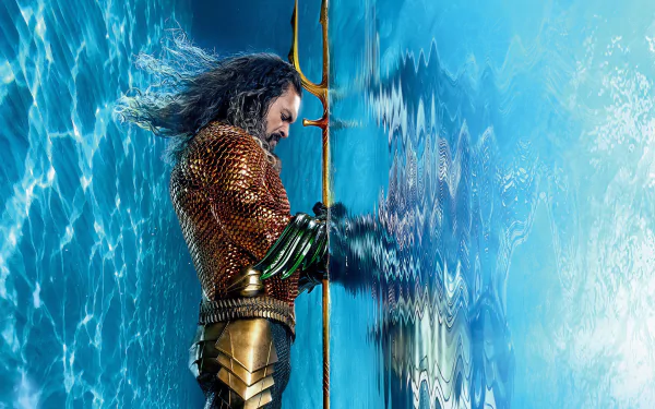 Aquaman character poised with trident in front of a dynamic water backdrop, from Aquaman and The Lost Kingdom movie, in HD wallpaper for desktop backgrounds.