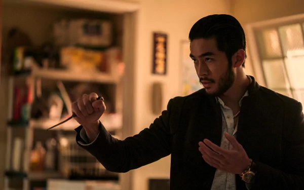 HD wallpaper featuring a scene from 'The Brothers Sun' TV show with a focused male character in an intense pose.