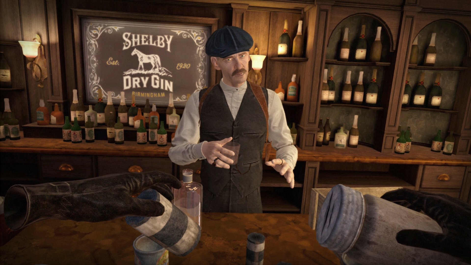 HD wallpaper of a scene from Peaky Blinders: The King's Ransom video game featuring a character resembling a 1920s bartender with a flat cap, standing behind a bar with bottles and a Shelby Dry Gin sign.