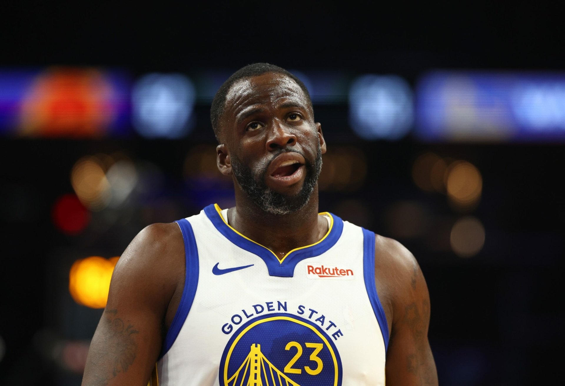 Draymond Green of the Golden State Warriors is featured in this HD desktop wallpaper, showcasing his intense focus during a game.