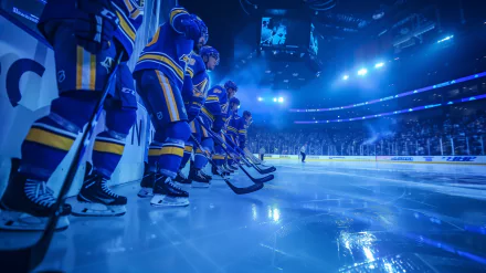 St. Louis Blues hockey players lined up on the ice rink, illuminated under blue lights - HD desktop wallpaper and background.