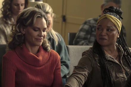 HD Wallpaper of 'Ordinary Angels' featuring two women, one with a turtleneck sweater and the other with a headscarf, giving the impression of a heartfelt moment from the movie.