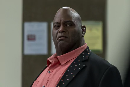 A character from the TV show Better Call Saul, looking serious in a vibrant shirt and blazer, captured in a high-definition wallpaper format.