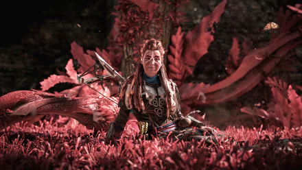 HD desktop wallpaper of Aloy from Horizon Forbidden West video game, surrounded by vibrant red foliage.