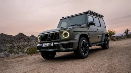 Mercedes-AMG G63 in matte finish parked on a desert road at dusk, suitable as an HD desktop wallpaper and background.